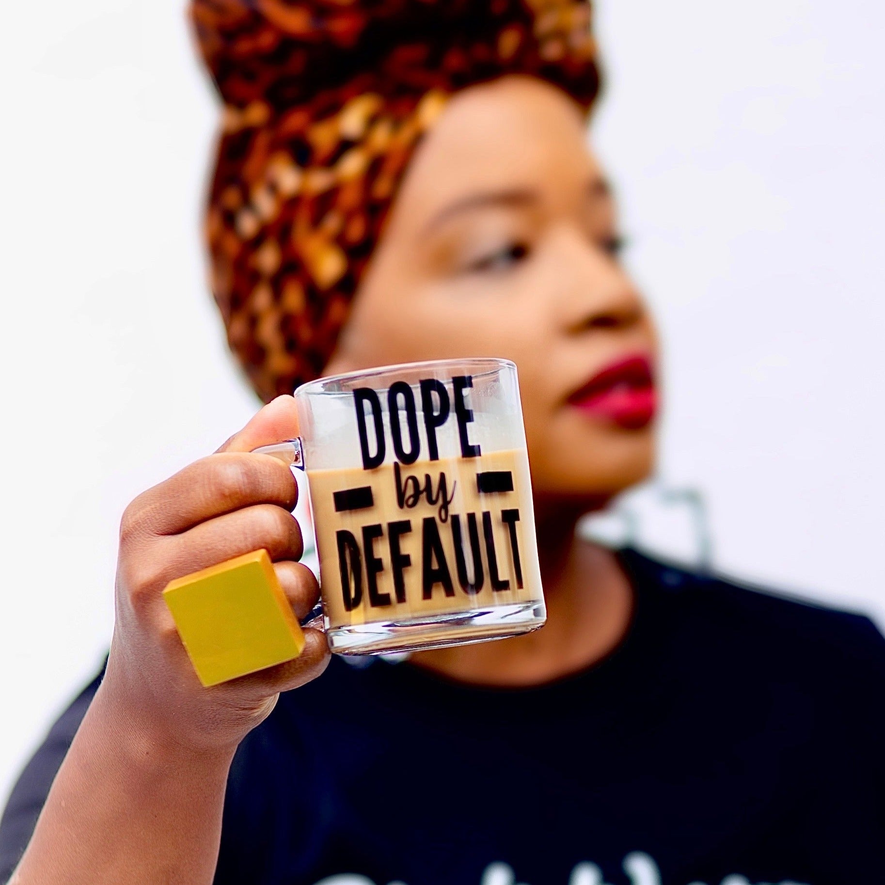Dope by Default clear glass mug holding