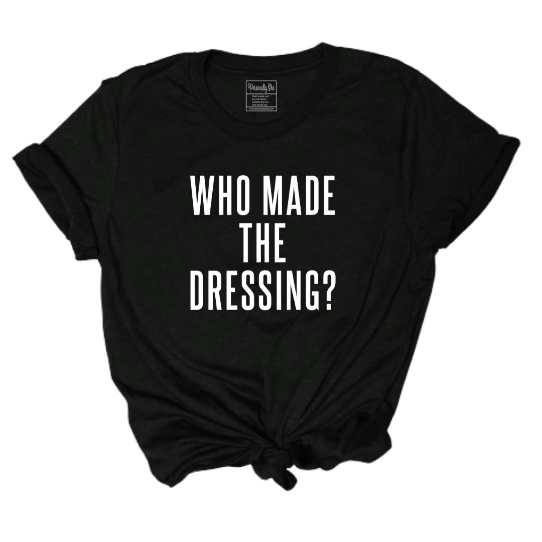 Who made the dressing holiday tee
